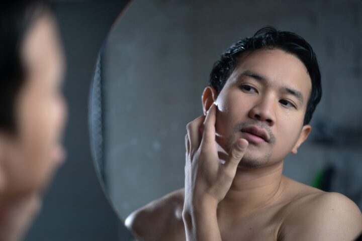 Man applying face cream